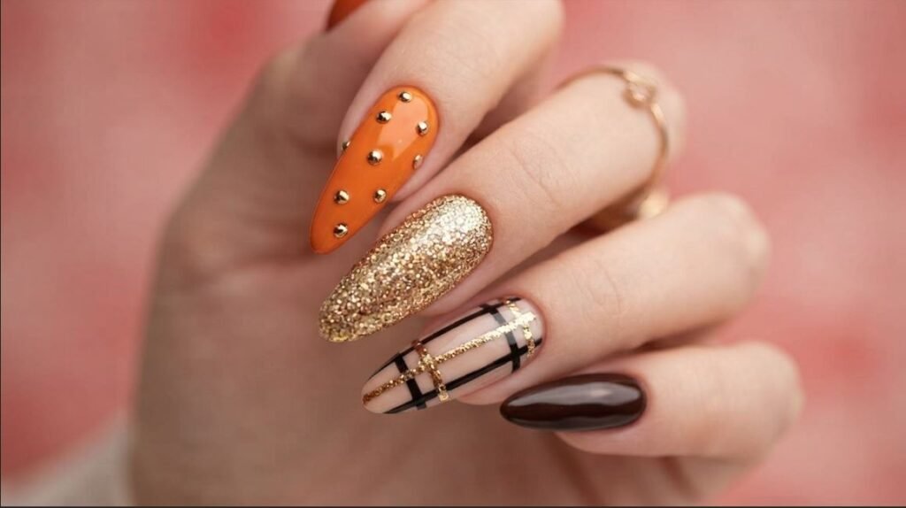 18-year-old female hand with very white skin holding dark mug with burnt orange and copper nails.
