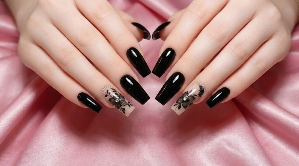Fanned female hand showing sheer nude coffin nails with minimal black floral linework.