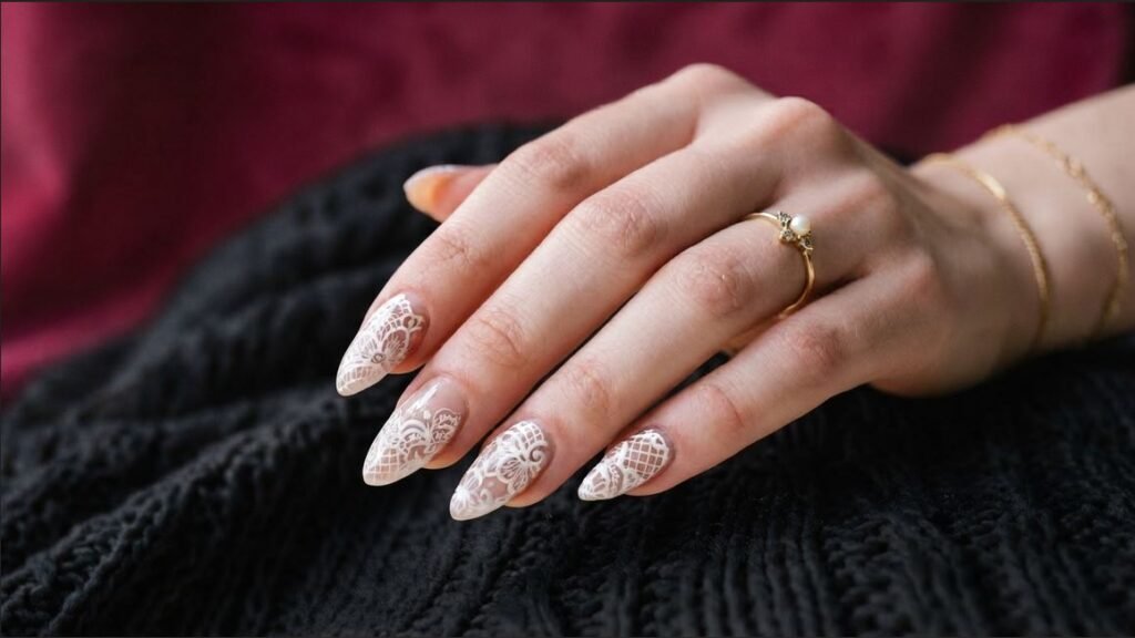 18-year-old female hand with very white skin featuring white doily lace art on short almond nails.