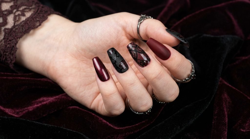 Medium coffin gothic heart nails displayed on an 18-year-old female hand.